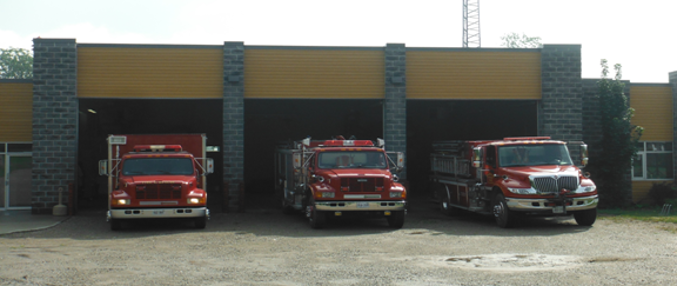Brownsville Fire Department Fire station located in Brownsville, building and 3 fire engines inside of a building